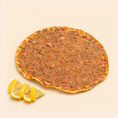Lahmajo with lemon wedges