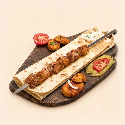 Pork ikibir skewer on lavash