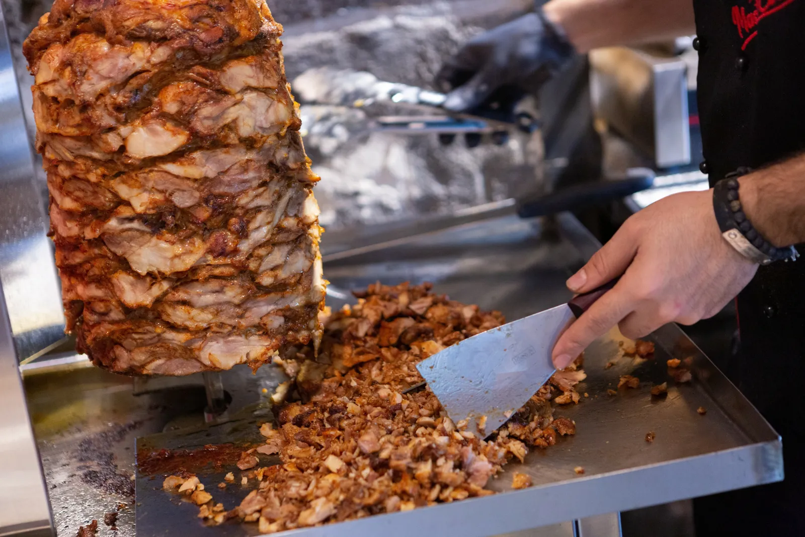 Chef carving meat from the doner at Master Class