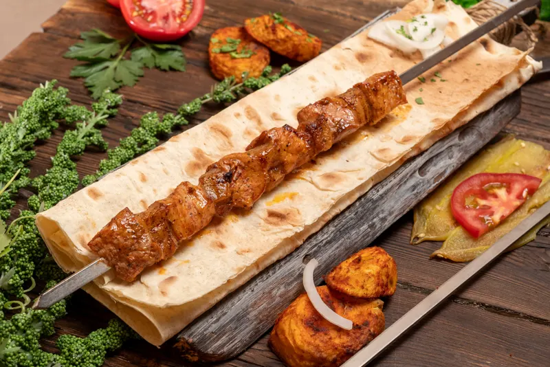Pork ikibir on lavash with grilled potato